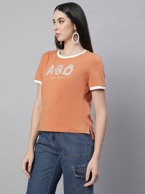 women orange round neck embellished top